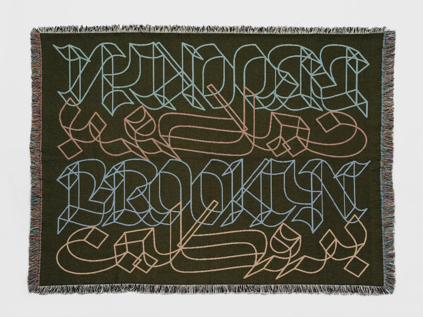 Black textile work with brooklyn lettering in four different fonts, design and art by wael morcos in ford foundation gallery's reverberations, lineages in design history.