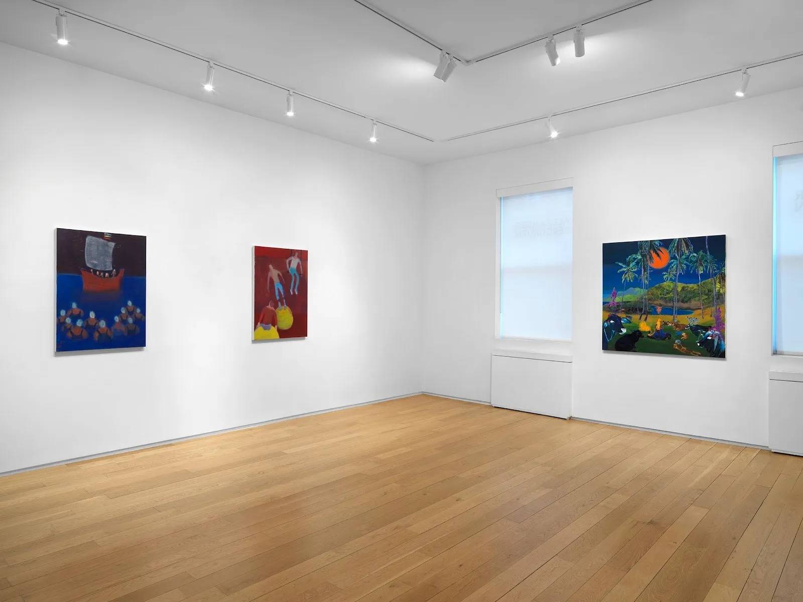 Installation corner shot of a white gallery room with hardwood flooring. Two walls are visible with three paintings of varying color and form hung on the walls.