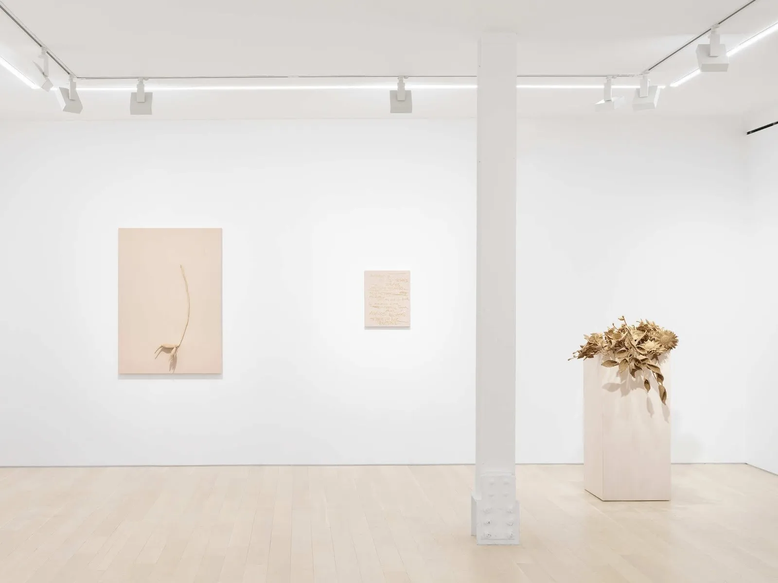 White cube gallery room with beige textile work and raffia sculptures, Joël Andrianomearisoa: Miracle at almine rech.
