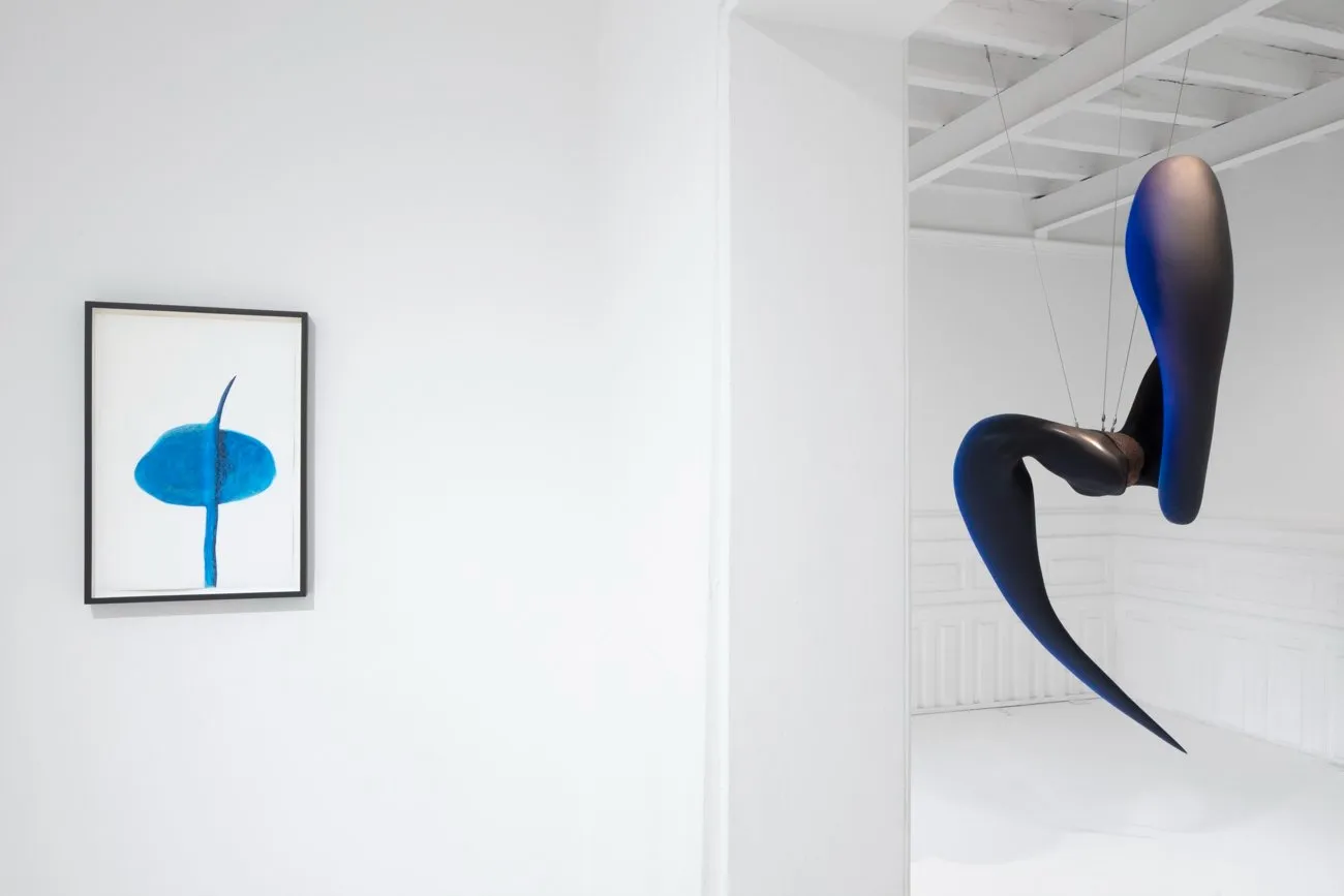 Blue hanging sculpture and blue watercolor piece on wall, Teresa Solar Abboud, Tu sombra sustituida installation view at Travesía Cuatro, CDMX, México.