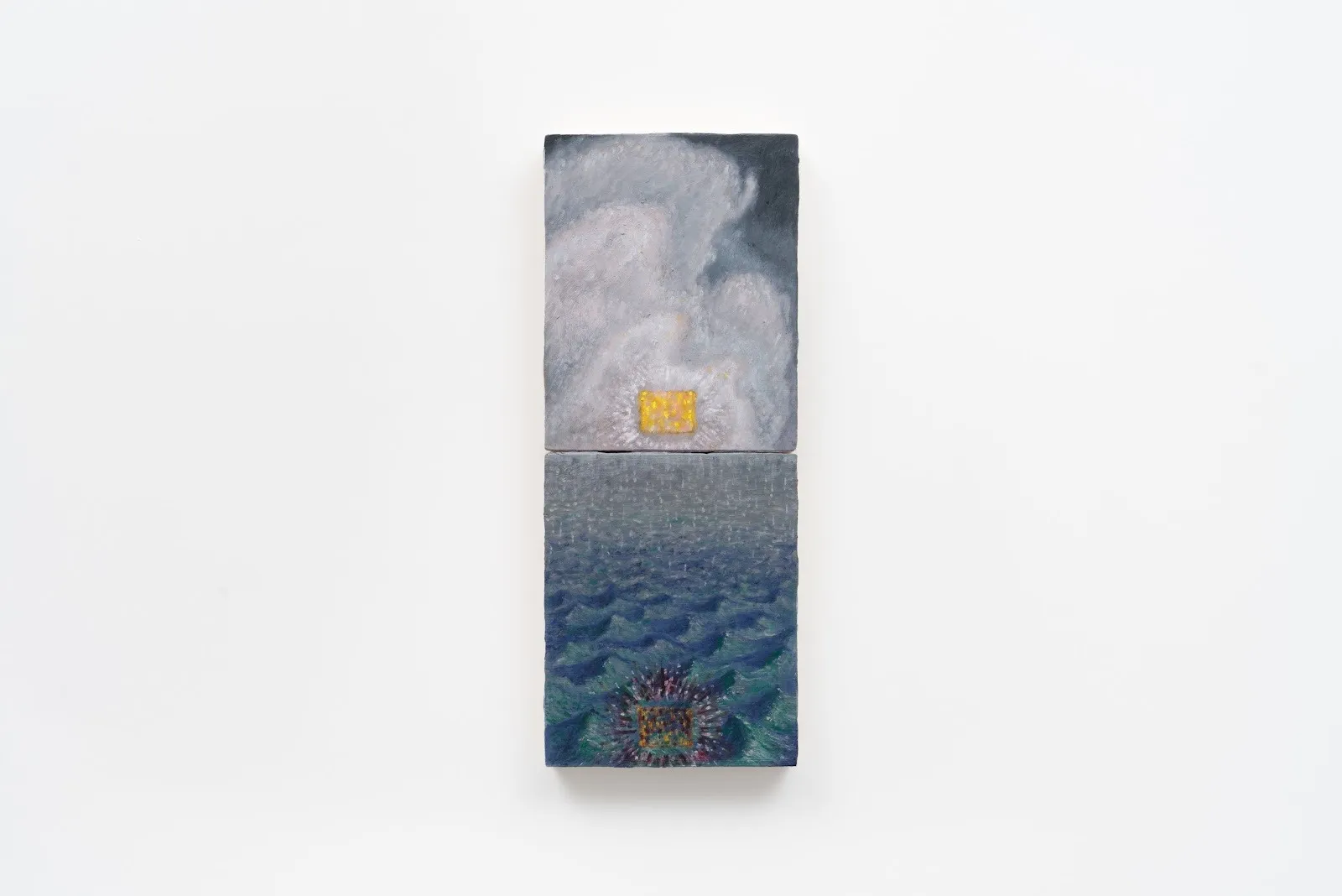 Installation frontal shot of painting against white wall. Painting is made up of two panels. The top is grey and yellow, like clouds and a rectangular sun; the bottom is blue and features wave-like imagery.