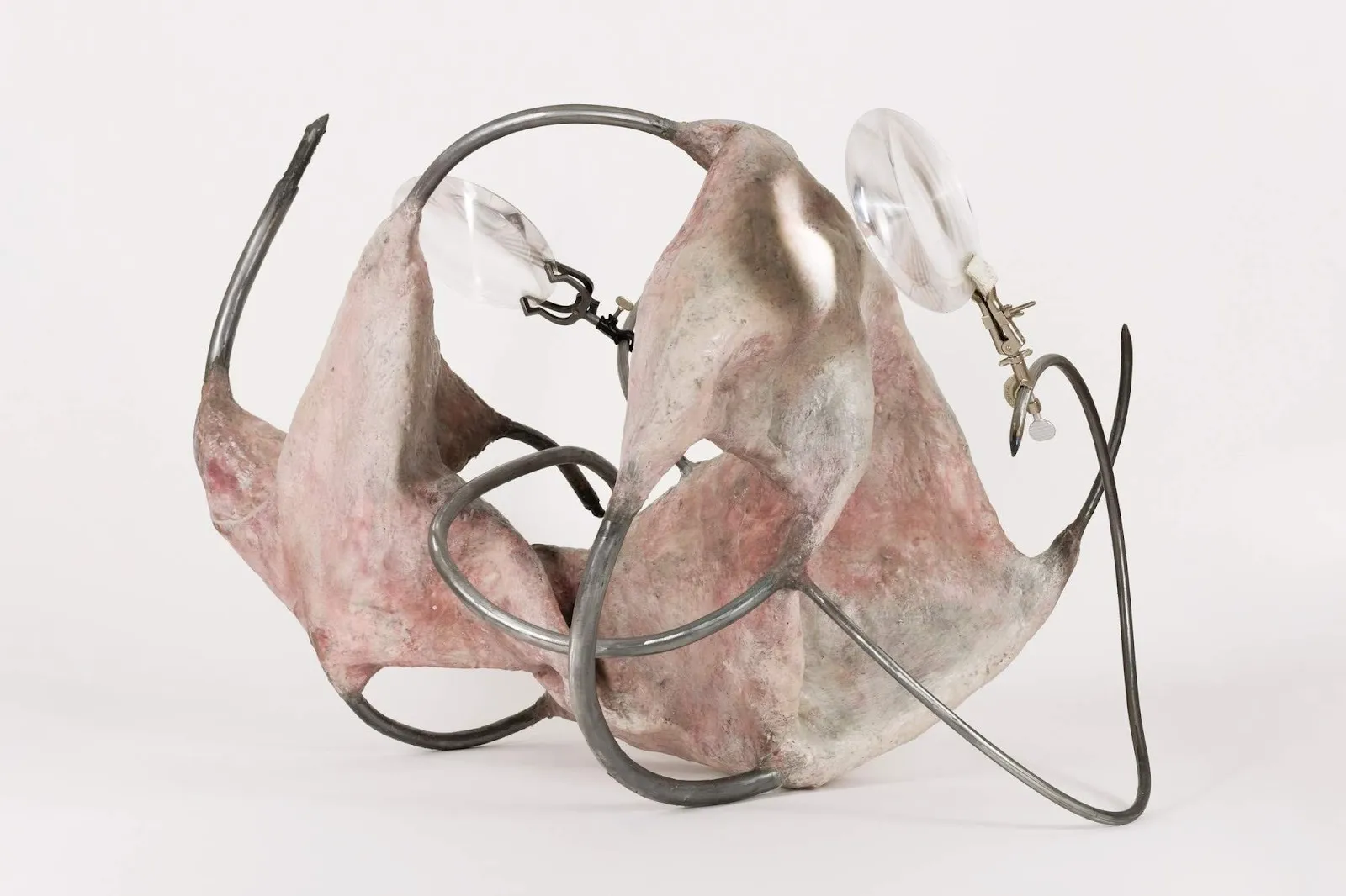 Rodrigo Ramírez, Something Outgrown; An Injured Secret Of Minds I (2025). Steel, resin, beeswax, wire mesh, concrete, paper, Fresnel lens, and lab clamps. 51 H x 39 W x 36 D in. Courtesy of the artist and Swivel Gallery.