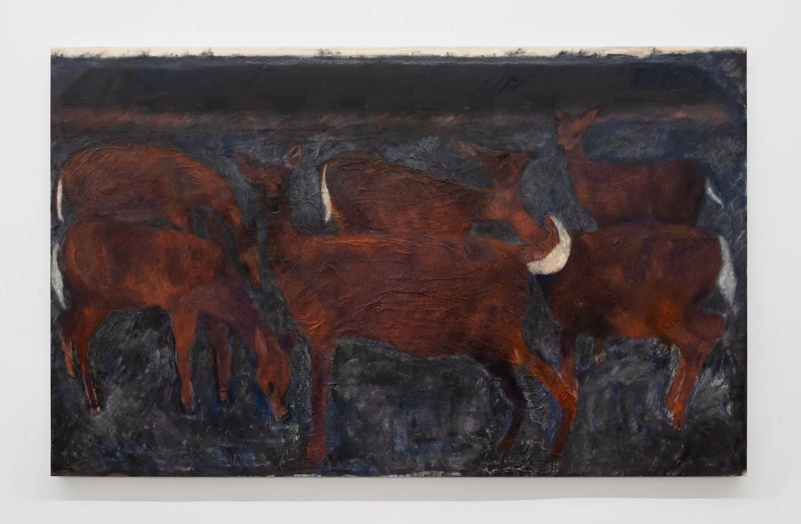 Frontal image of a large horizontal canvas. Against a dark, blue black brushstroked background, slightly abstracted renderings of dark brown deer with white tails graze and look in different directions.