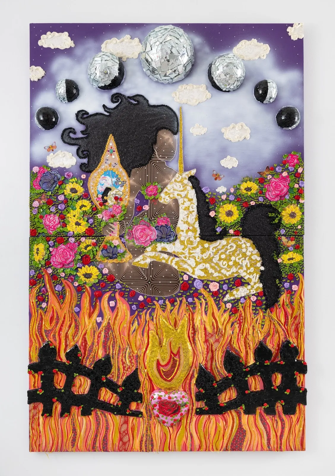 A highly-decorated and colorful wall work features flowers, fire, moon cycles, and an abstracted female figure and unicorn.