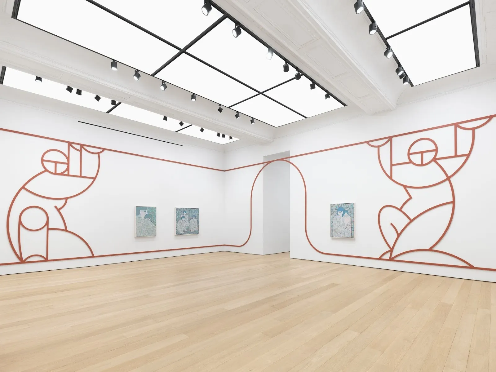 Three medium-sized paintings with blue palettes line the walls of a white gallery, in addition to a large bas-relief outline of two abstracted figures holding up architectural lines which snake along the exhibition's walls and doorways.