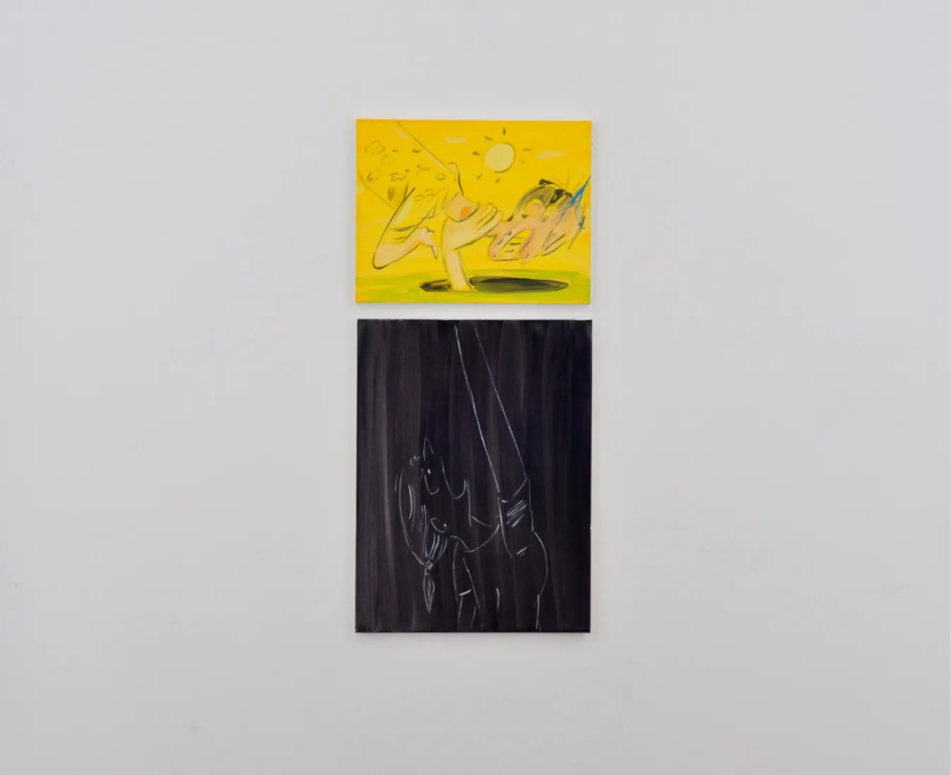 Two paintings are hung together vertically. The top, smaller painting is predominantly yellow, with a cartoonish figure reaching down a hole. The bottom painting is predominantly black, with a figure outlined in white reaching up.