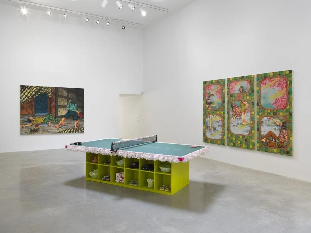 A white gallery room houses two paintings and one sculpture. One painting is a painted window-like triptych, while the other depicts a scene of two figures. The sculpture is a modified, green table tennis structure.