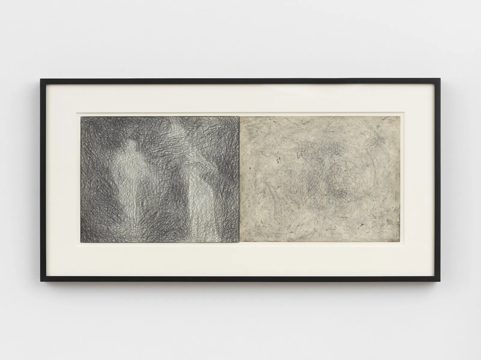 A framed graphite on paper diptych is made of two sheets of paper, one marked heavier than the other. Both feature traces of graphite scratches and marks. The left sheet depicts a lighter blurry figure against shadowy noise.