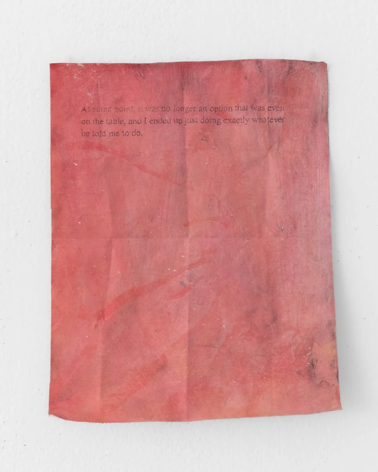 Brushstrokes and splatters are visible on a light red-painted paper. At the top, text reads "At some point, it was no longer an option that was even on the table, and I ended up just doing exactly whatever he told me to do."