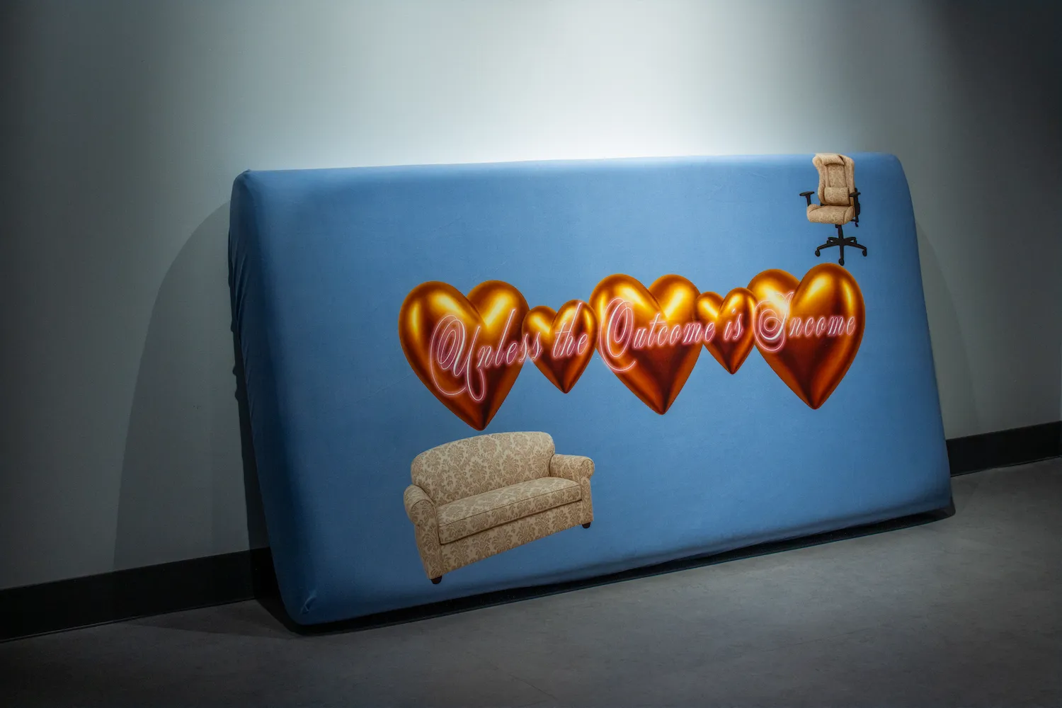 A large blue upholstered panel featuring shiny gold heart icons and cursive neon-style text that reads “Unless the Outcome is Income,” with digital stickers of a patterned sofa and an office chair.