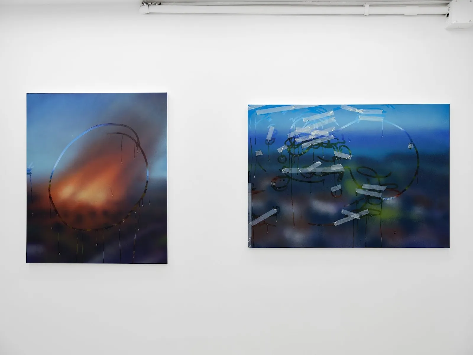 Two large abstract paintings with misty, airbrushed gradients and hand-drawn marks resembling circles and scribbles, one incorporating tape-like elements.