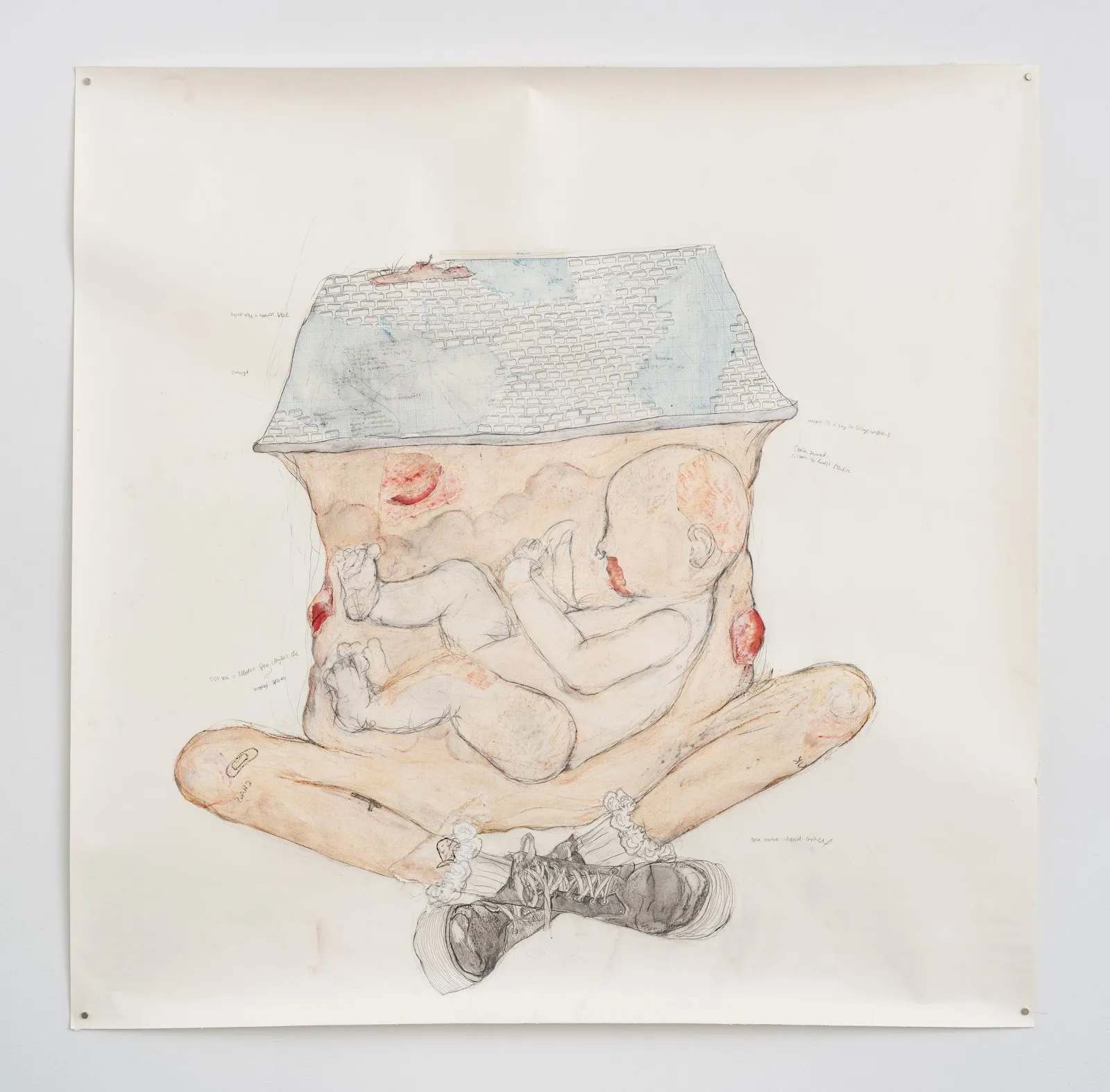 Drawing of a baby curled inside a torso with a house-shaped roof on top, crossed legs below, and scattered handwritten text.