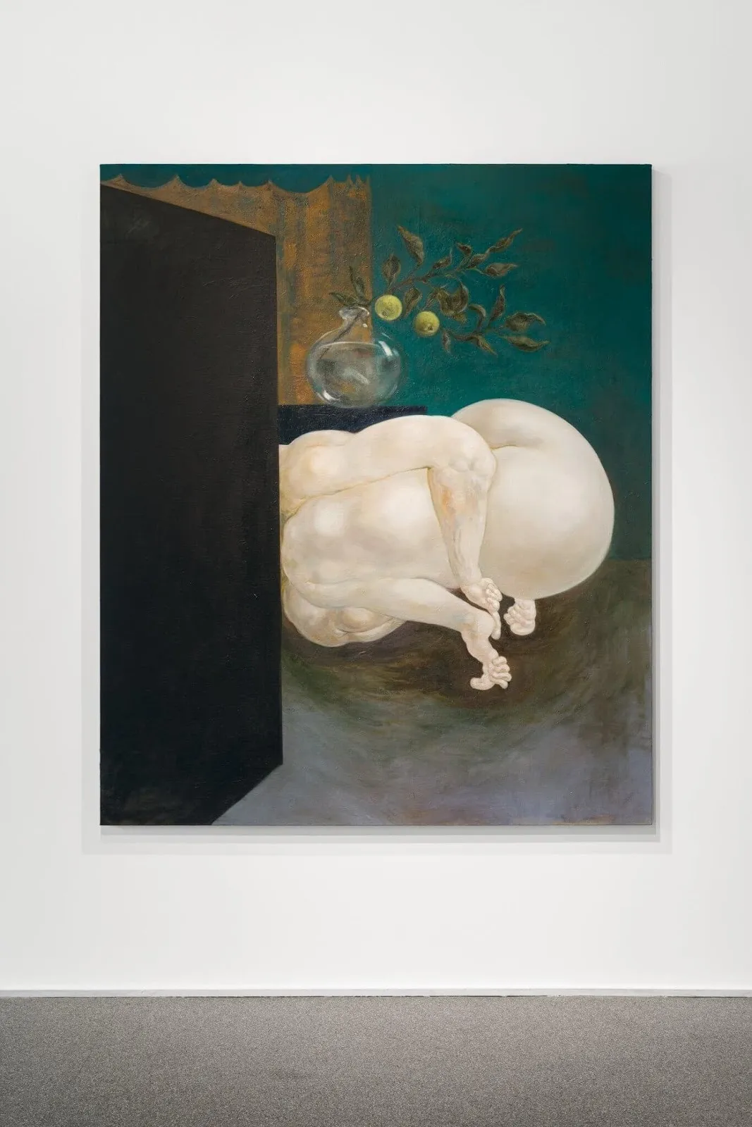 A painting of a simple interior with a single glass flower vase hosts a nude, curled-up figure lies on the ground. The figure's face is obscured by a black screen or wall. The figure's appendages are distorted.