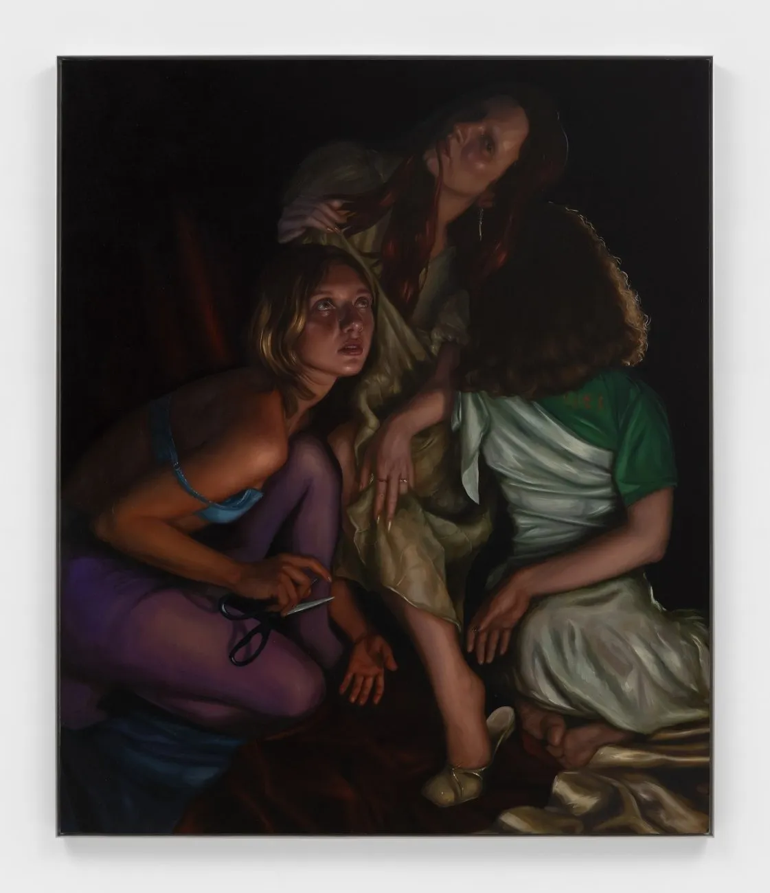 A painting depicts three figures in various positions in chiaroscuro lighting. One figure crouches and holds scissors, looking up. Another leans, leg forward, head bent. The third kneels, turning their head so that their face is completely obscured.