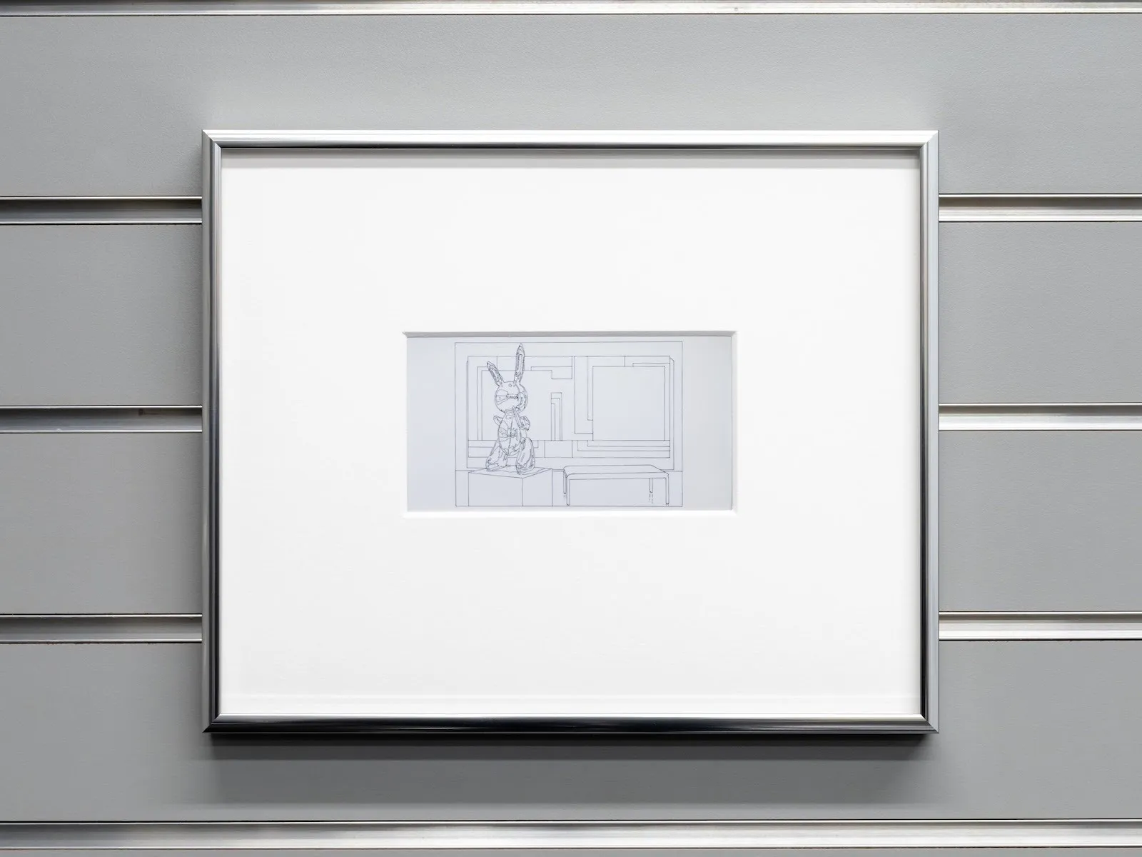 Small minimalist line drawing of a rabbit sculpture and bench, centered within a large white mat and frame.