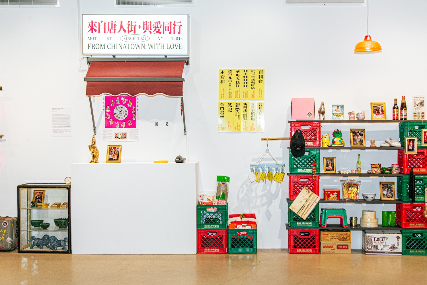 Installation view featuring a recreated Chinatown storefront and personal memorabilia.