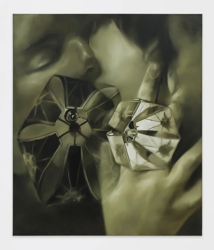 Monochromatic painting in sepia-green tones of two faces close together in an embrace, with a hand raised near the jaw wearing an ornate, faceted ring; a matching angular, jewel-like form is reflected or doubled in the lower left.