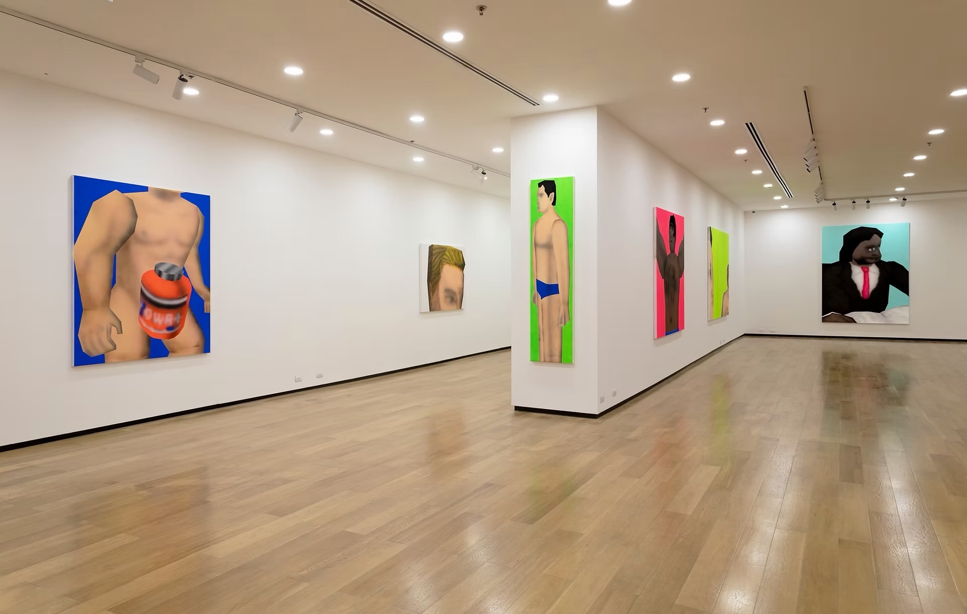 Gallery installation featuring brightly colored paintings of low-poly human figures arranged throughout a white-walled exhibition space.