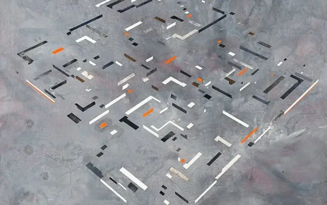 Abstract geometric pattern with scattered black, white, and orange rectangular shapes on a textured gray background.