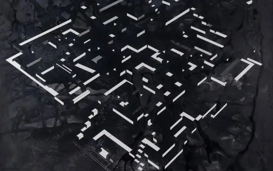 A complex maze outlined in white lines on a dark textured surface.