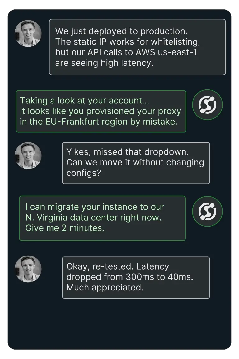 Chat conversation where a user reports high latency with AWS us-east-1 API calls, support identifies a proxy misconfiguration to EU-Frankfurt, offers migration to N. Virginia data center, and user confirms latency improvement from 300ms to 40ms.