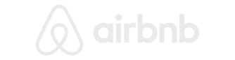 Airbnb logo in white on a black background.