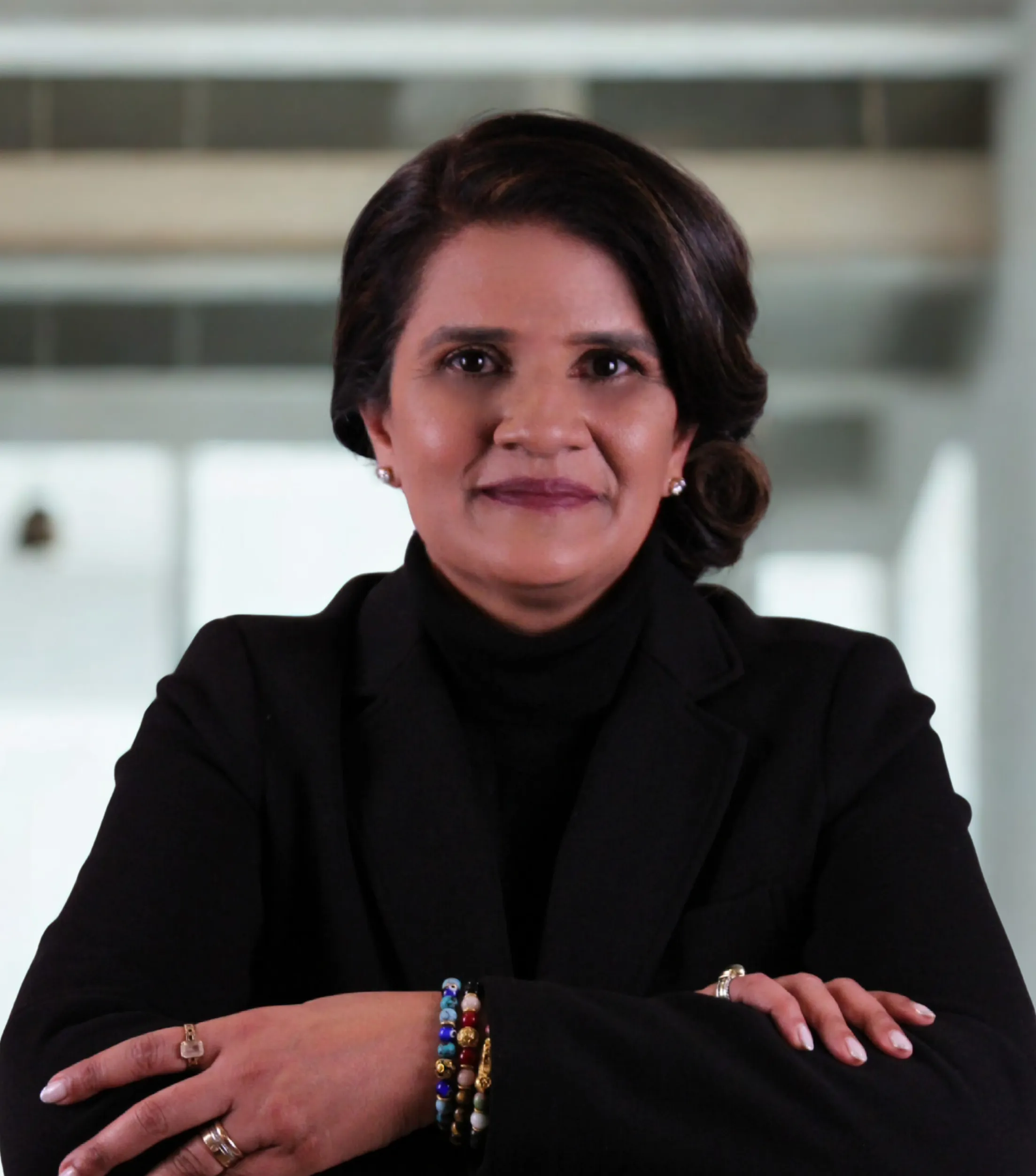 Professional headshot of Reena Vaswani, representing E.K. Associates.