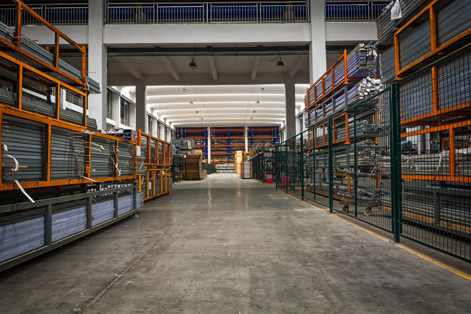 Forklift moving pallets in organized warehouse facility
