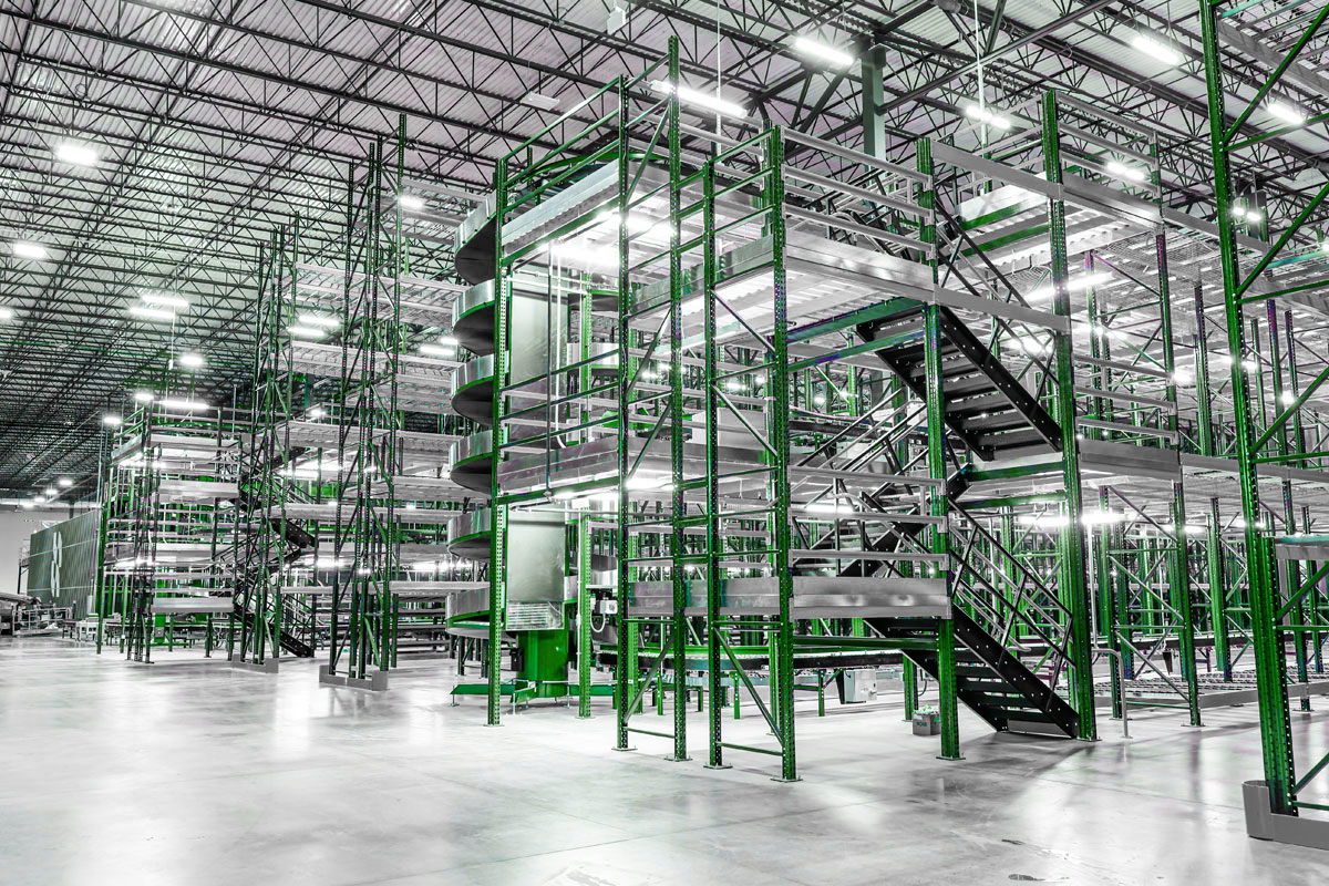 Warehouse project manager reviewing installation plans on-site