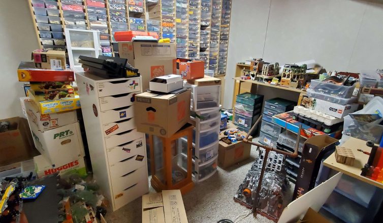 Organized storage room with Legos collection in bins and boxes ready for moving