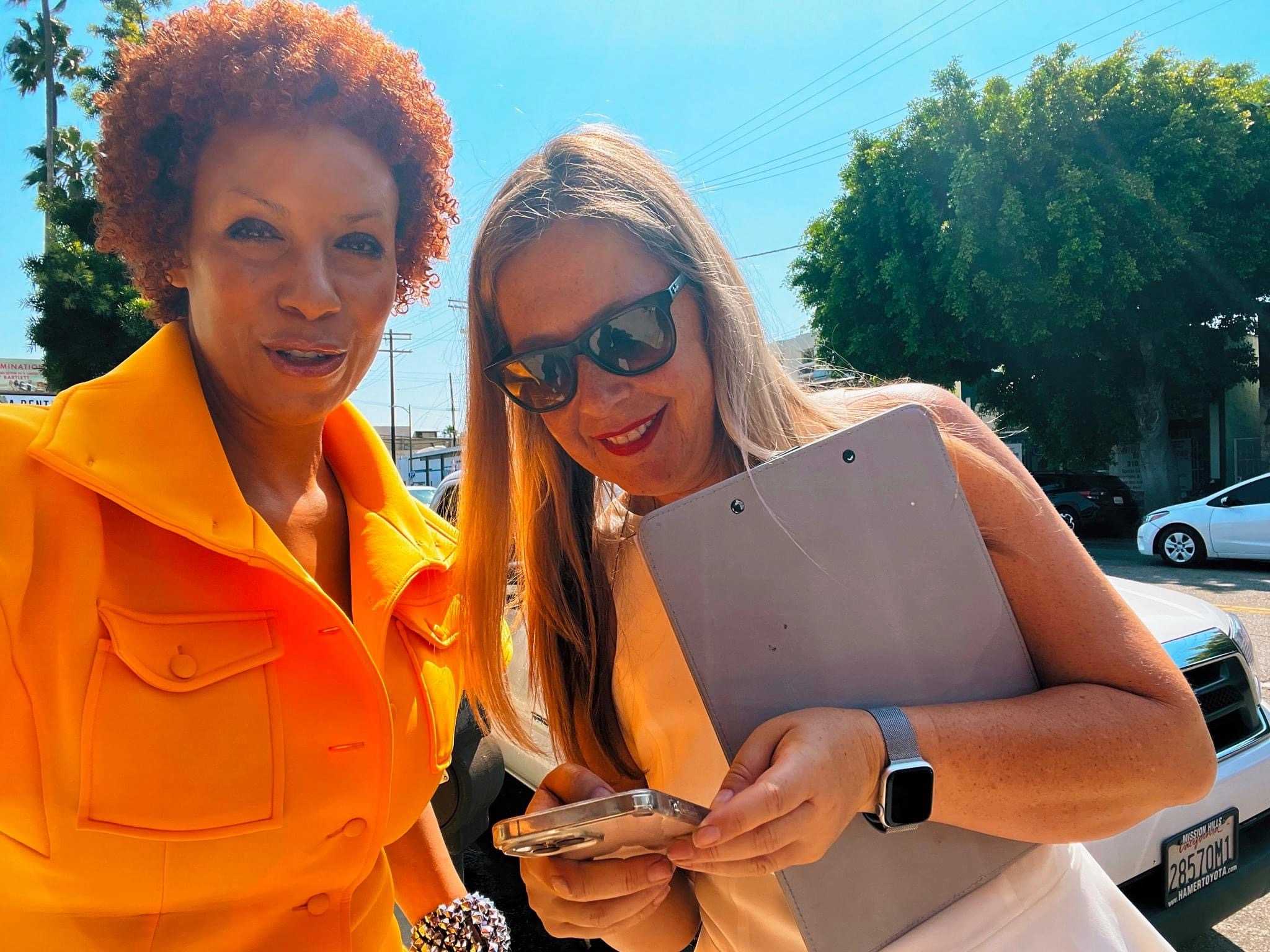 Behind-the-scenes close-up of a film director or producer wearing a 'Guardians of the Galaxy' cap while working on a production set