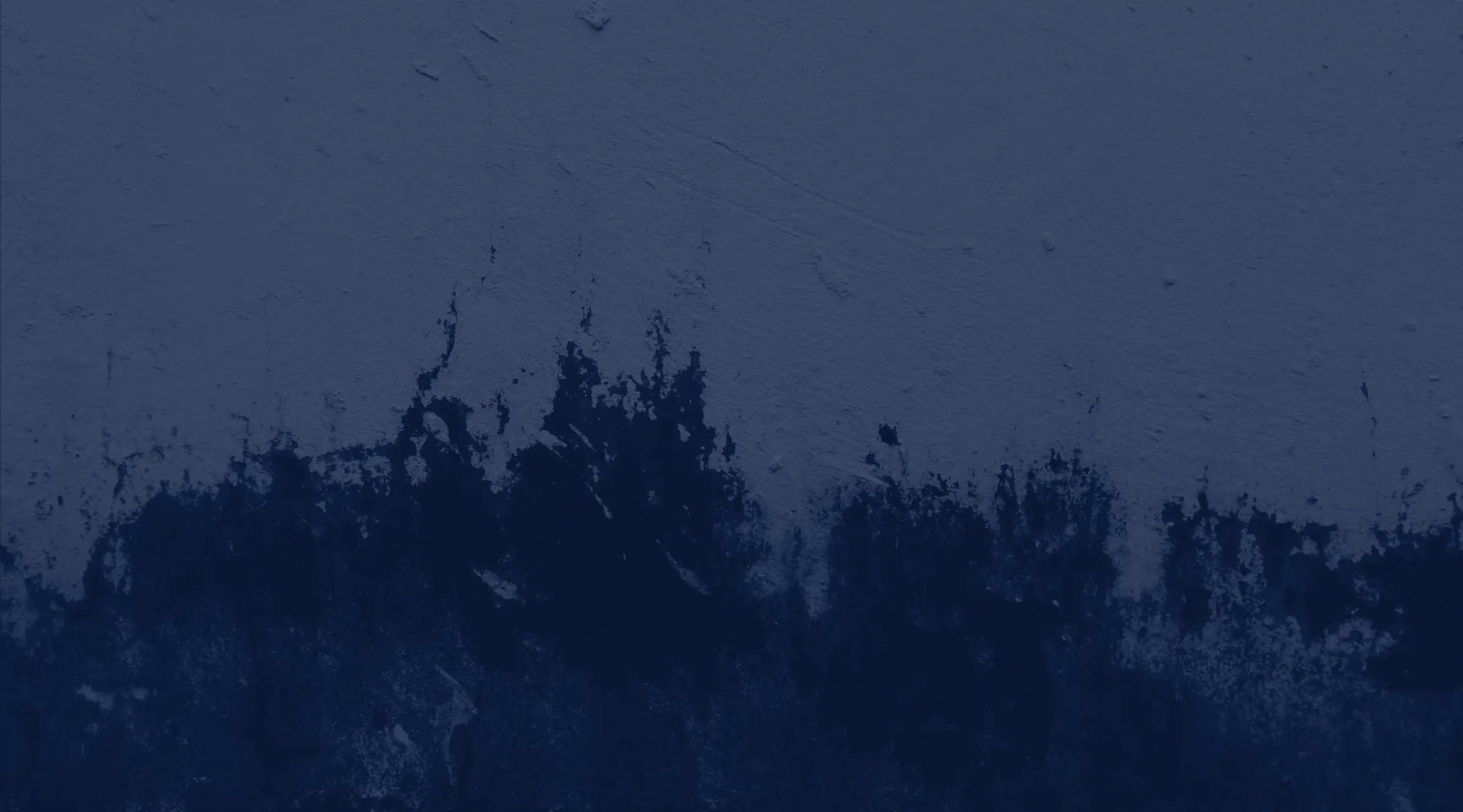 A blue background with a white splash of paint.