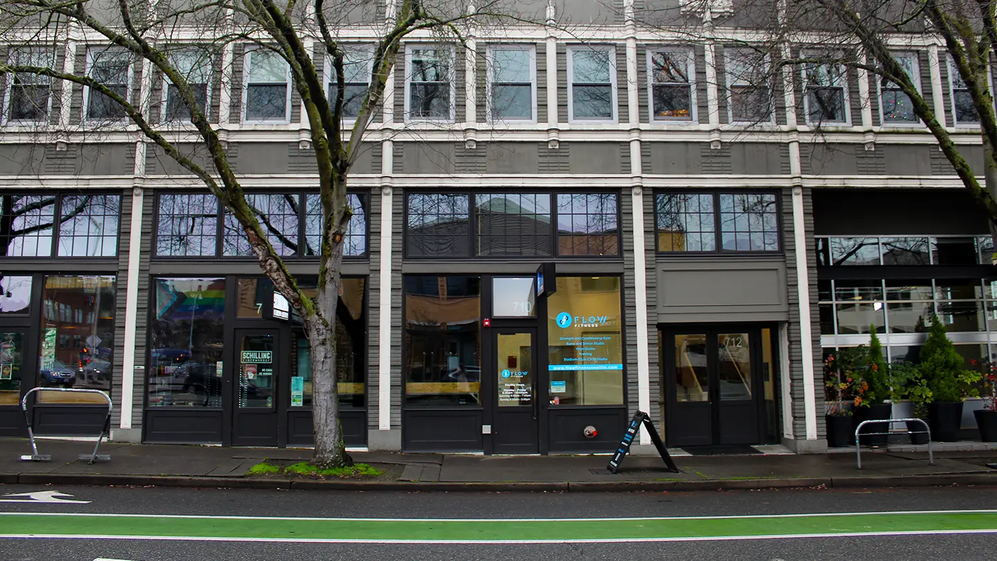 A green bike lane in front of a building.