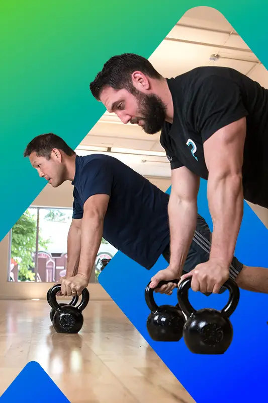 Two men are lifting weights in a gym.