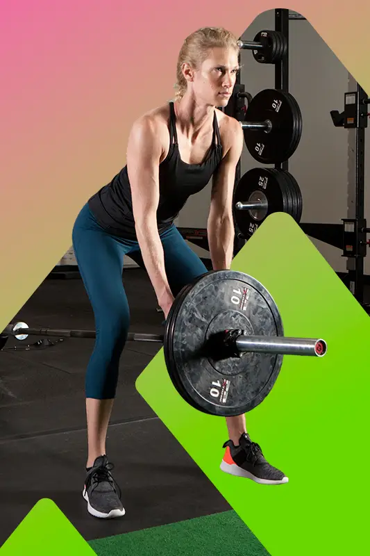 A woman lifting weights in a gym.
