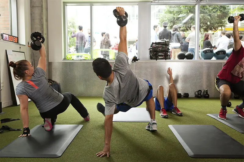 A man doing a push up on a mat.