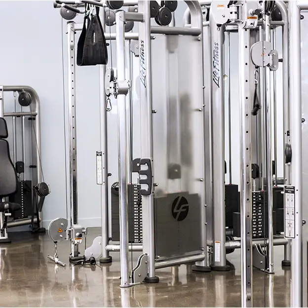 A gym with a machine that says Lift on it.