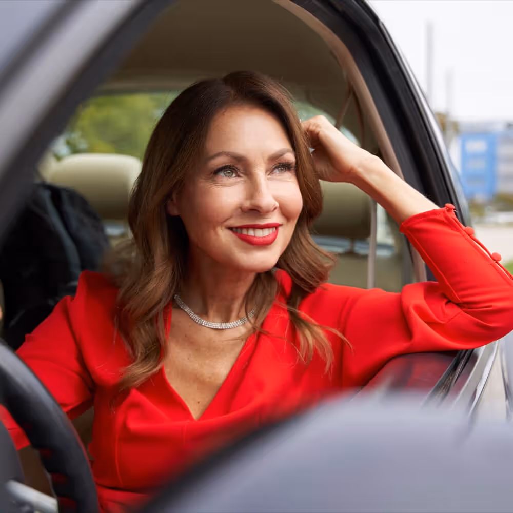 Passenger seated in a vehicle, representing rideshare use and transportation-related legal concerns.