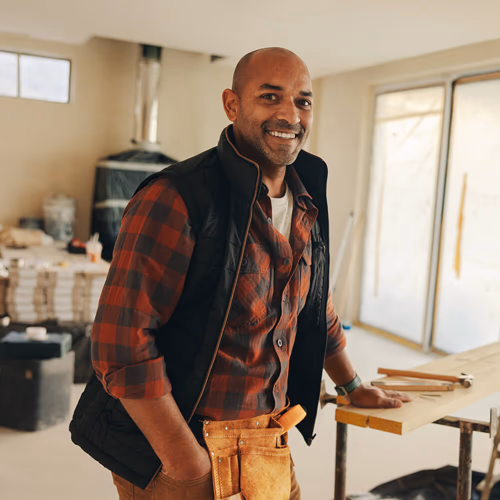 Small business owner standing in a worksite, representing small business operations and legal support.
