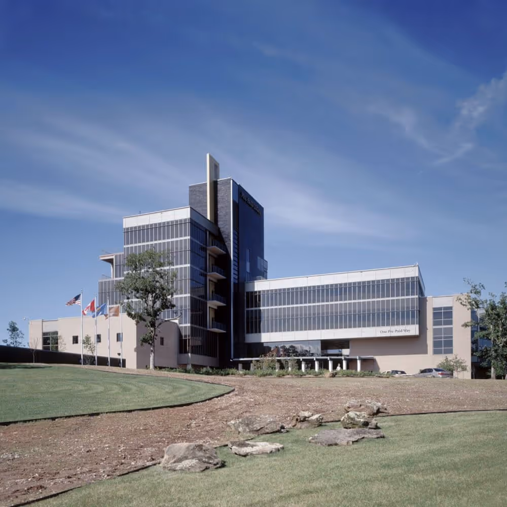 Exterior view of the new home office complex building on a landscaped campus.