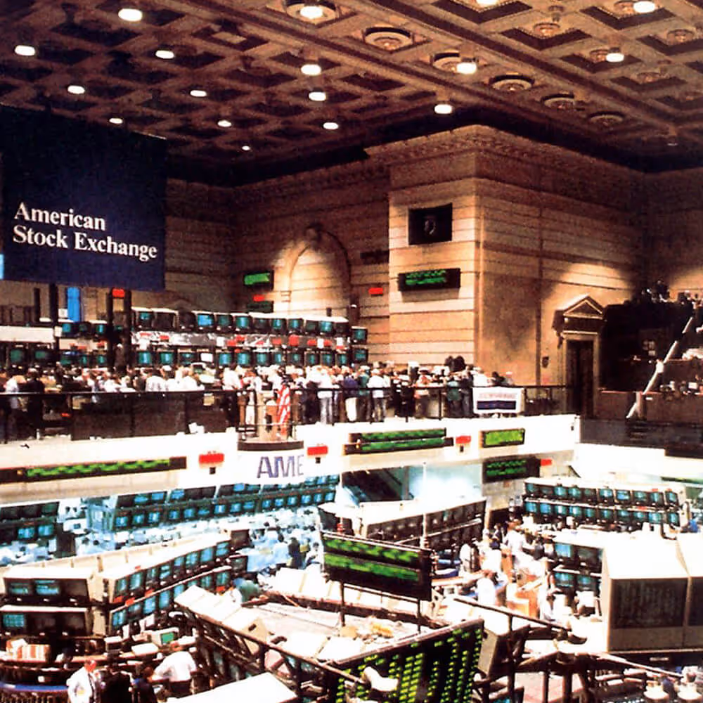 Historic view of the American Stock Exchange trading floor, representing Pre-Paid Legal’s business history.