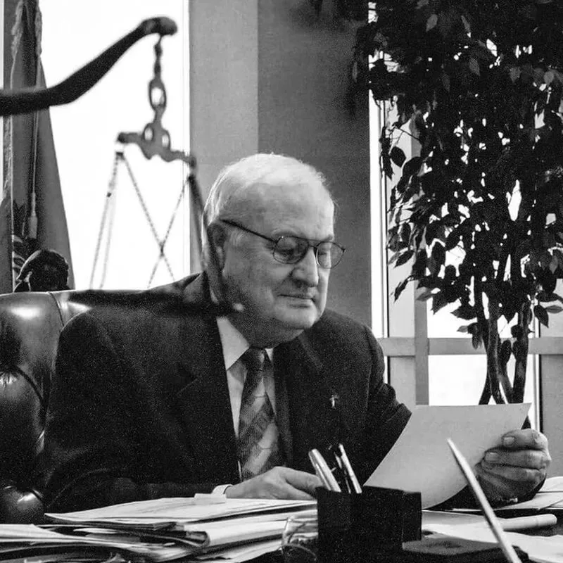 LegalShield founder Harland Stonecipher seated at his desk