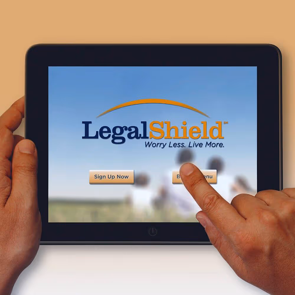 LegalShield mobile app shown on a tablet screen with sign-up and menu options.