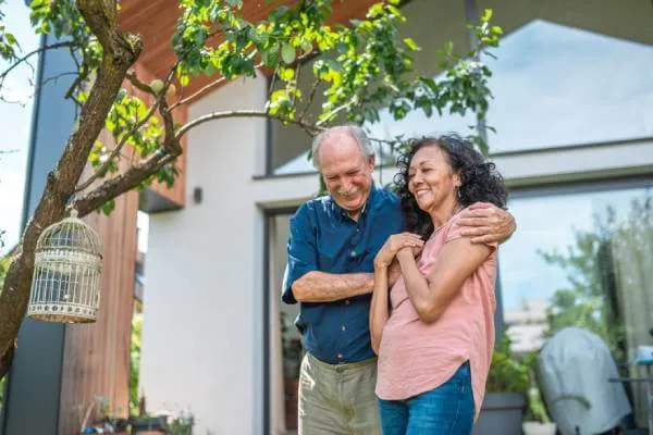 couple embracing on their property patio