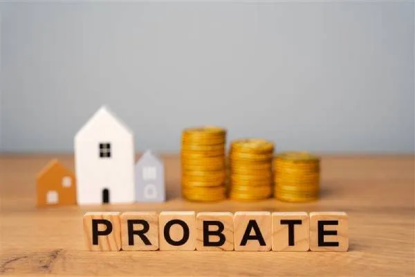 Probate spelled out in blocks in front of coins and model of house