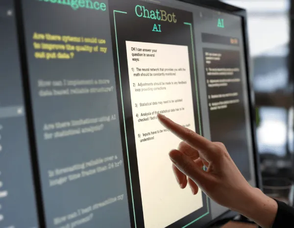 Woman pointing to a computer monitor as she using an online AI ChatBot to create a legal document.