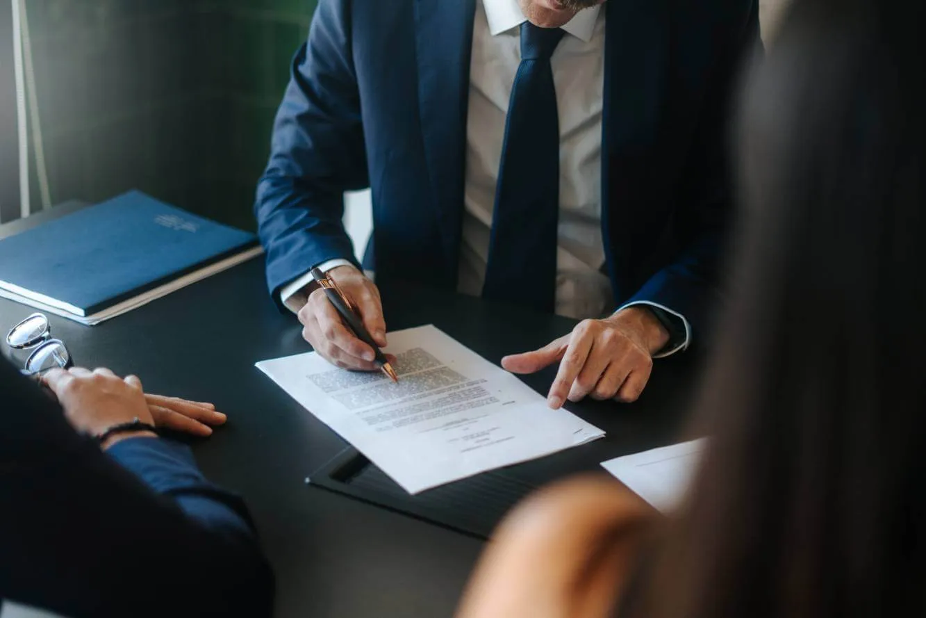 lawyer reviewing estate planning document for family