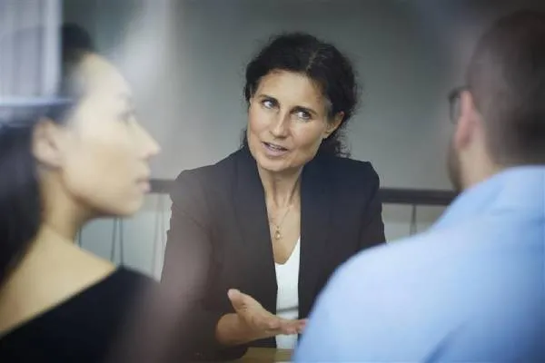 Female lawyer talking to clients about 23andMe DNA data
