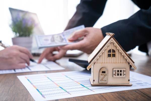 man paying earnest money for house