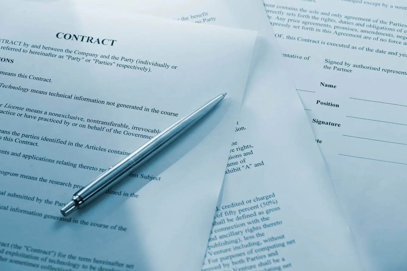 contract and ink pen